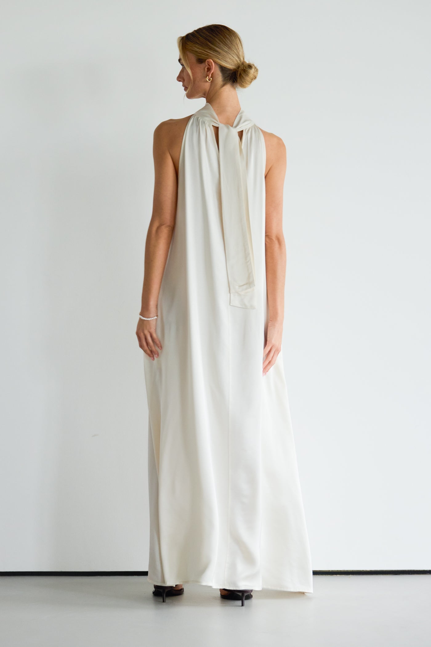 Back view of ivory halterneck satin dress